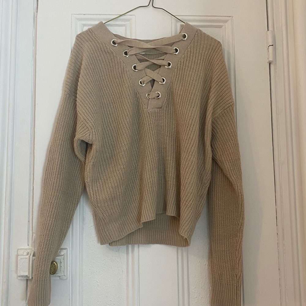 Cream sweater with lace up detailing